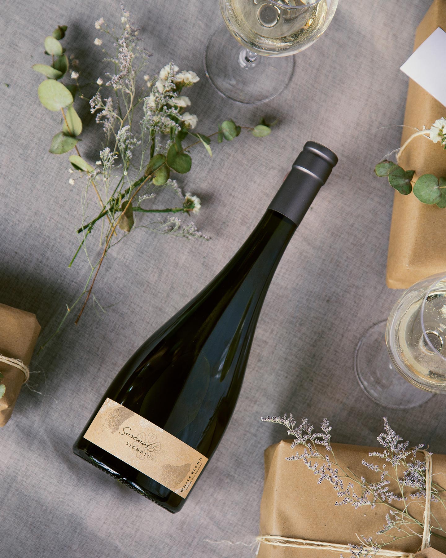 Susana Balbo Signature Brioso White Blend 2024 on table with flowers